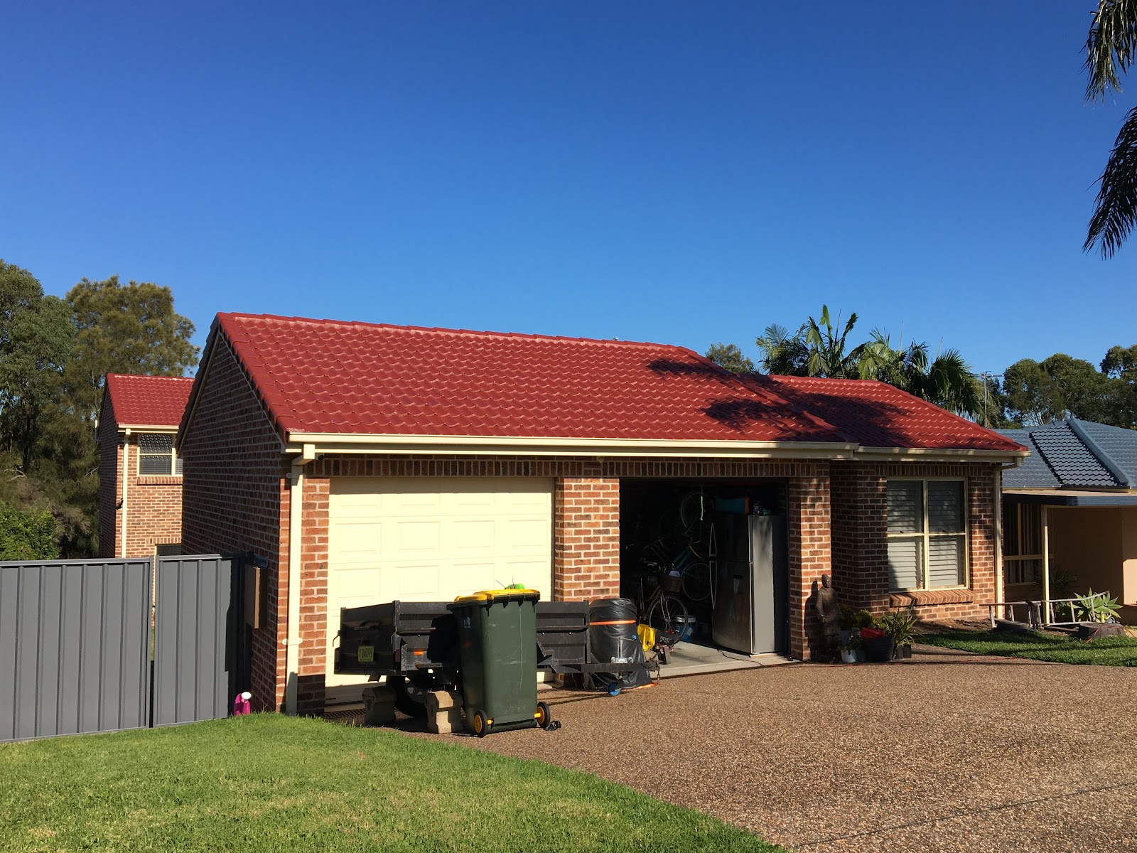 Brick home with a red tile roof